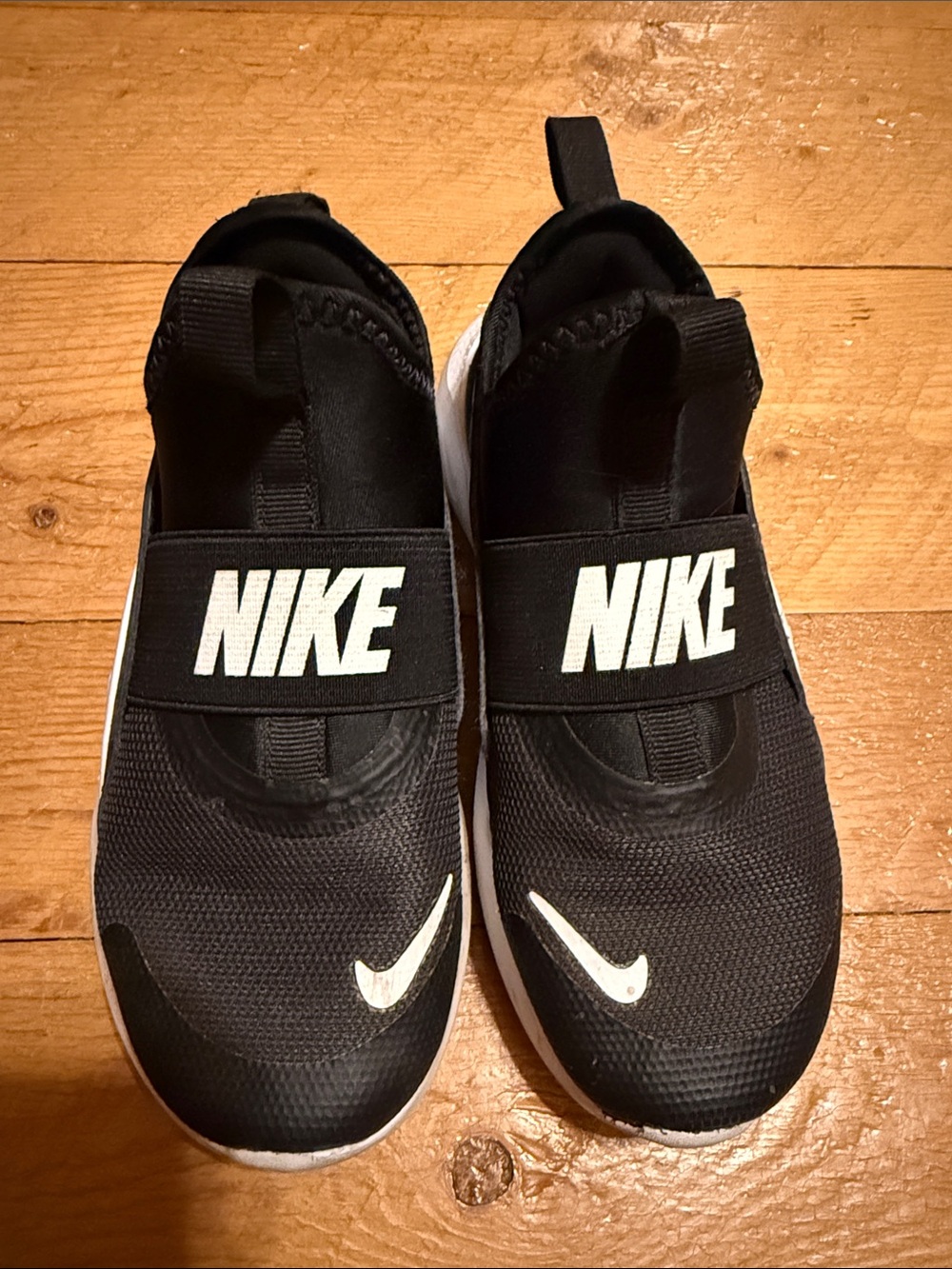 Nike Kids' Black Slip-On Athletic Shoes with White Swoosh